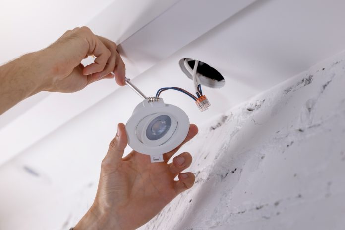 Electrician,Installing,Recessed,Lamp,In,Drywall,Ceiling.,Led,Lighting